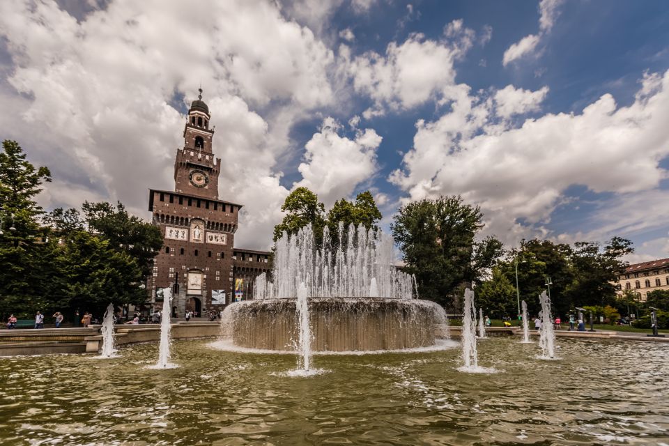 Milan: City Highlights Walking Tour with The Last Supper - Moving through central Milan: Gallery time, Piazza della Scala, and small-town-soul squares