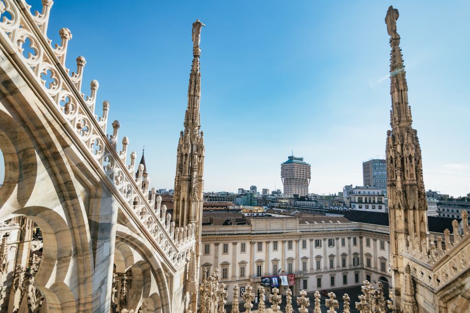 Milan: Duomo Rooftop and Cathedral Guided Tour with Tickets - Duomo Rooftop: lift up, then walk the spires up close