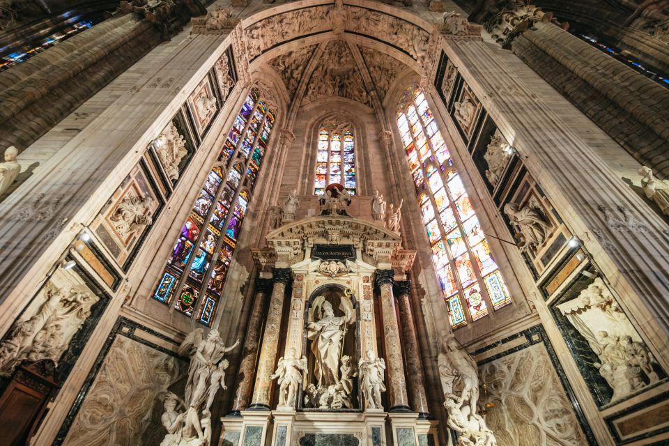 Milan: Duomo Rooftop and Cathedral Guided Tour with Tickets - Inside the cathedral: gothic architecture, stained glass, and sacred art